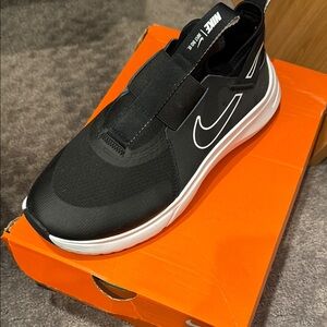 Brand new never been worn Nike slip on sneakers